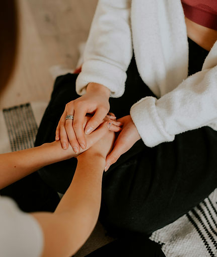 two women holding hands