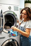 happy woman pouring blue laundry detergent into washer_edited.jpg