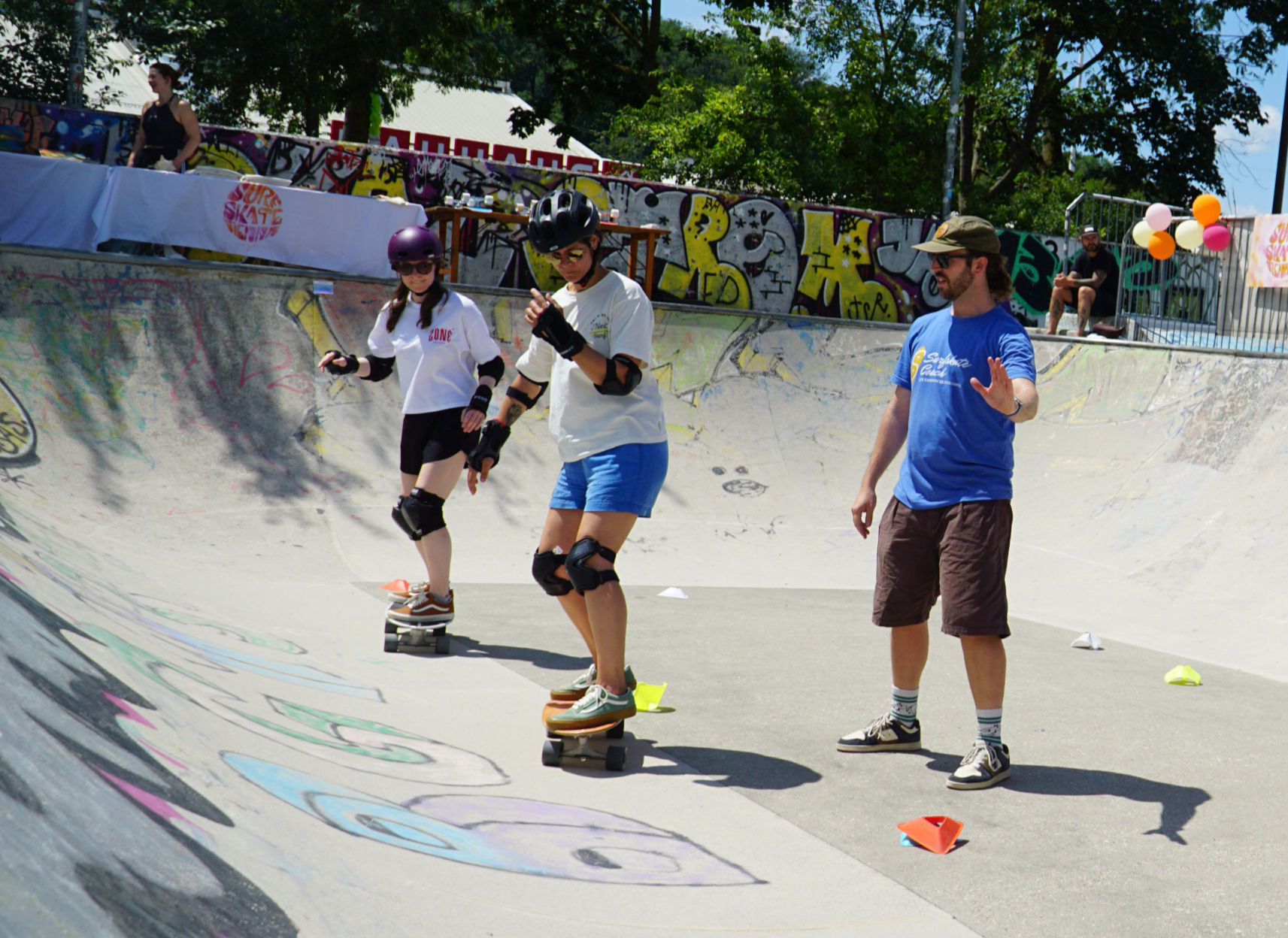 A surfskate esson with cones in Helsinki - A person doing turnings 