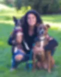 Woman and her 2 dogs posing for picture.webp