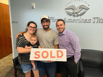 Happy family after selling their home