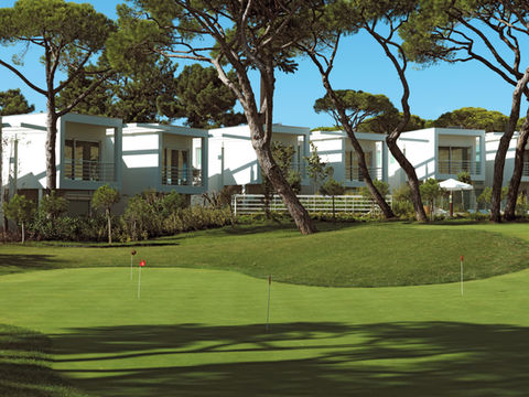 Back view of townhomes from a golf course