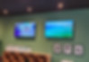 Wall mounted televisions in a restaurant