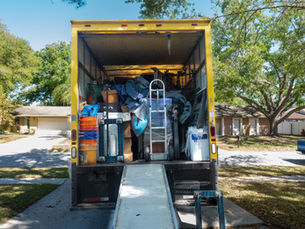 Back of a moving van with people's belongings.