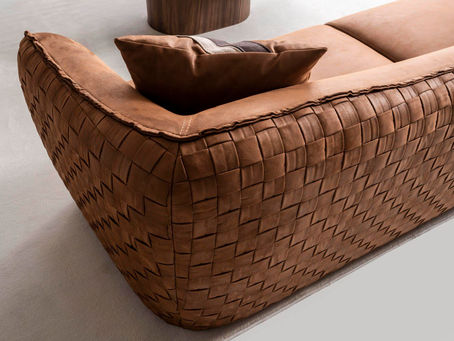 Close-up of a luxury sofa upholstered in woven vegan leather (faux leather) in rich brown, showcasing texture and craftsmanship — Diyar Luxury Home.