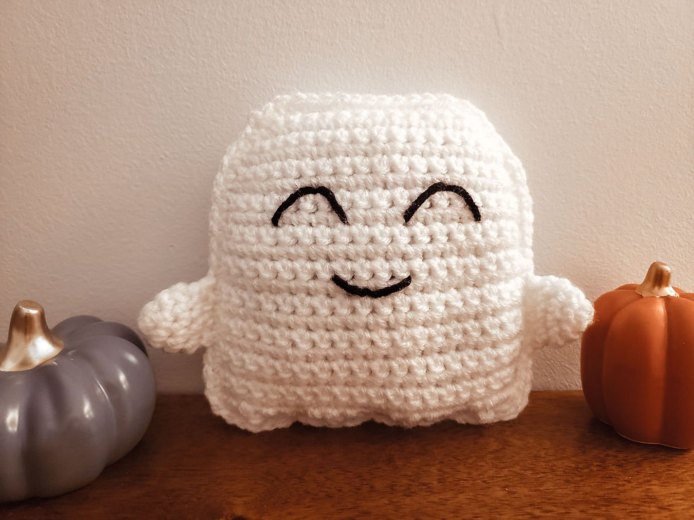 The finished crochet ghost color displayed as home decor.