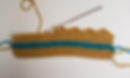 Creating the crown ridges in Row 8 while making the crochet crown coffee cozy.