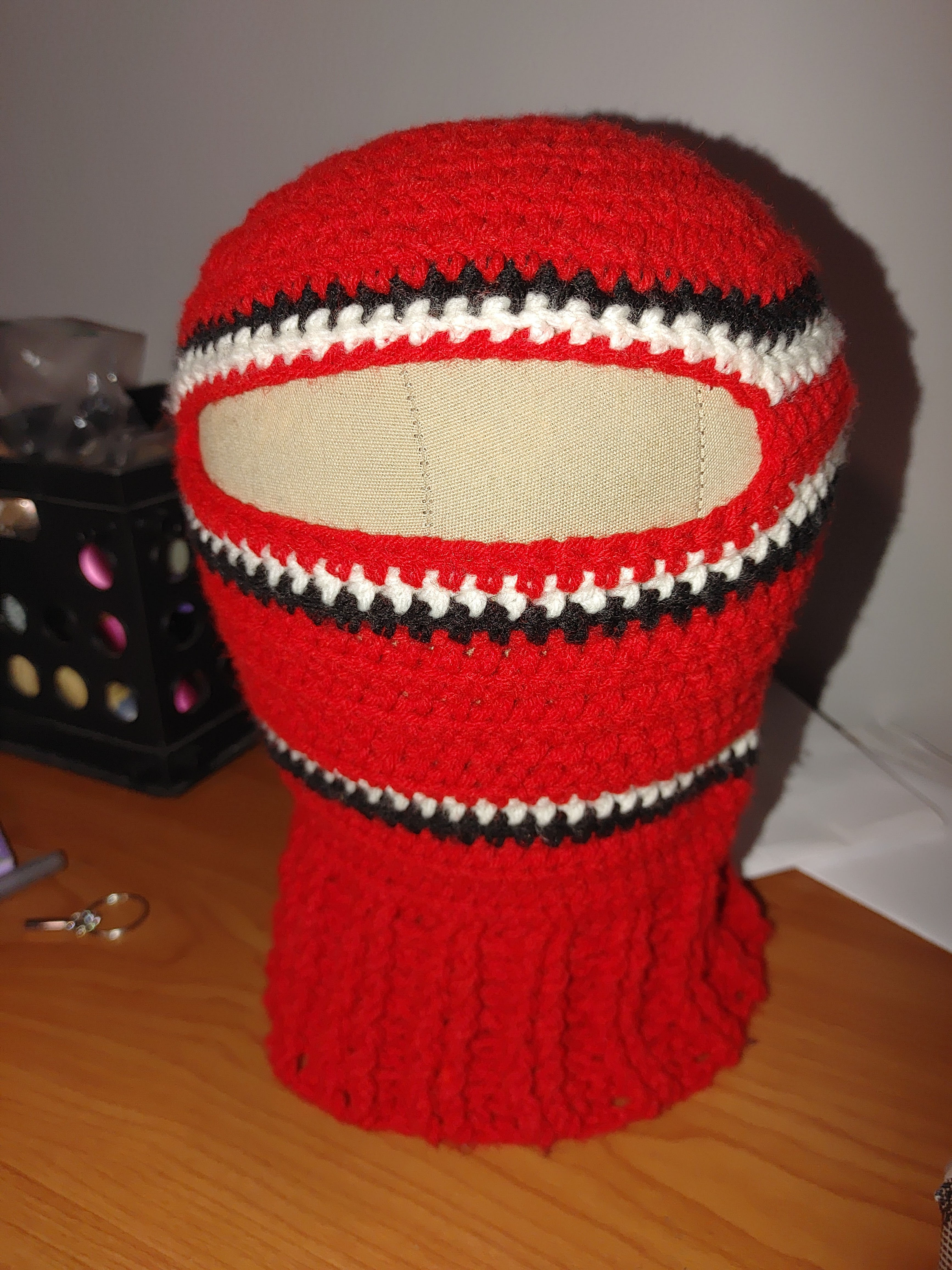 red, black, and white balaclava
