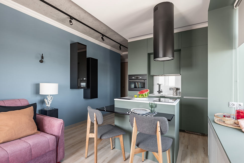 A sleek, well-organized small kitchen designed by TrendKit, featuring hidden storage solutions and multifunctional furniture.