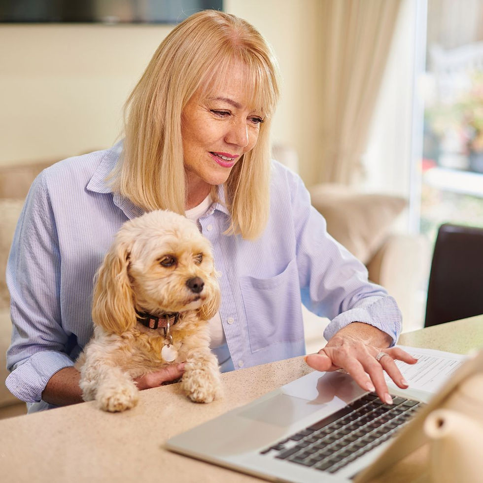 Woman and dog at computer.jpg