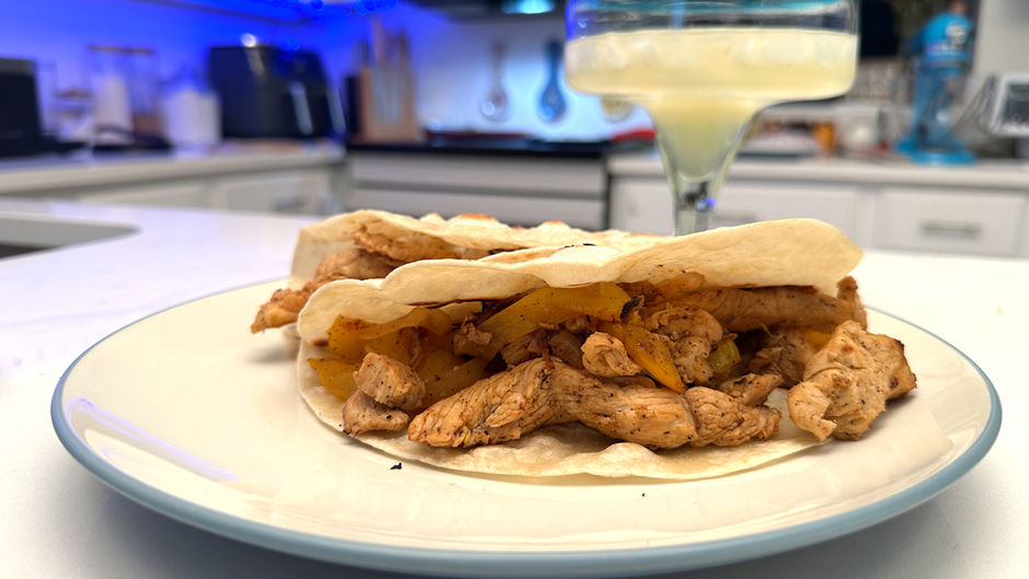 Taco of chicken fajitas on a plate. 