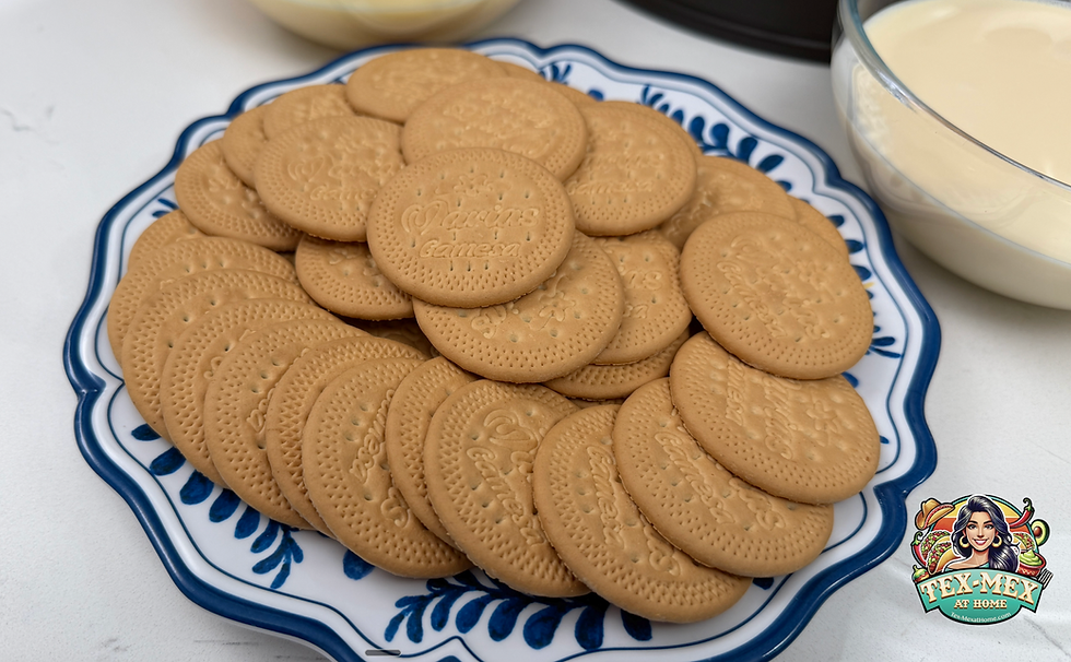 Plate of round Maria cookies on a blue-and-white dish beside a bowl of milk, with a Tex-Mex at Home logo in the corner