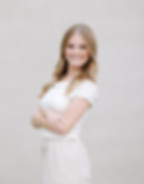 Smiling woman with arms crossed