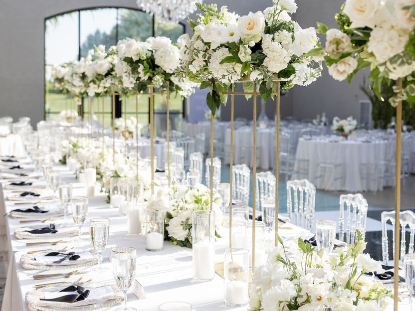 Elegant wedding reception table with white floral decor