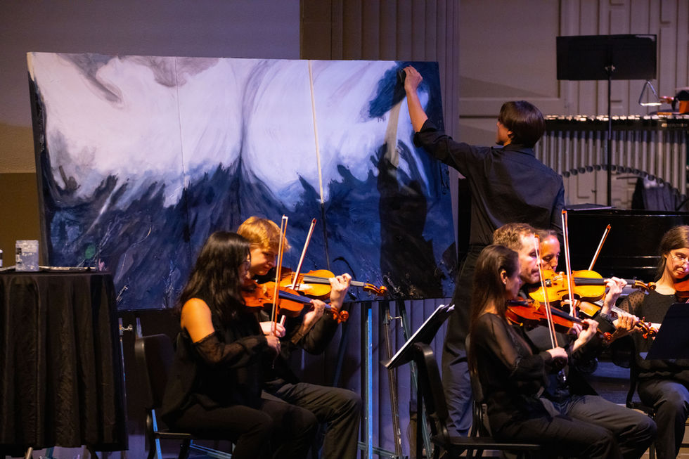 Jack Schnepf at the Bozeman Symphony live painting on stage during Sounds of America III: Appalachian Spring