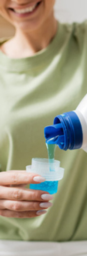 stock-photo-cropped-view-smiling-woman-pouring-liquid-washer-laundry-room_edited.jpg