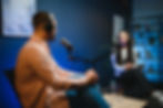 female-podcaster-in-headphones-interviewing-man-gu-2025-04-03-01-19-35-utc.jpg