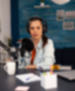 new-media-star-looking-camera-while-talking-into-microphone-video-podcast-social-media-inf