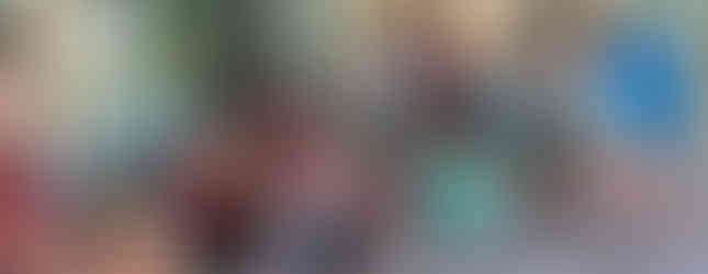 Kids eating supper and parents visiting around the pool.