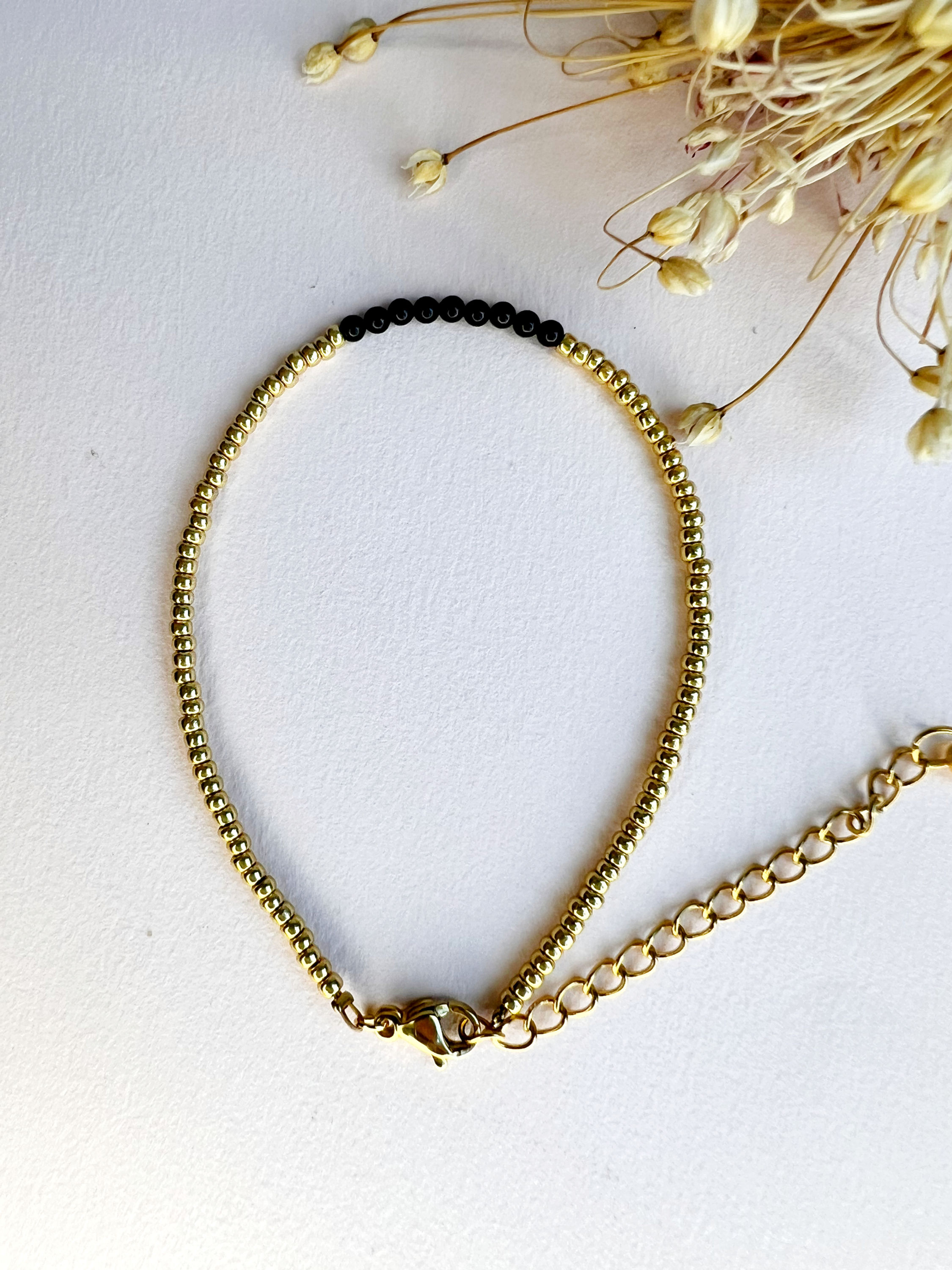 Gouden kralen armband met Obsidiaan