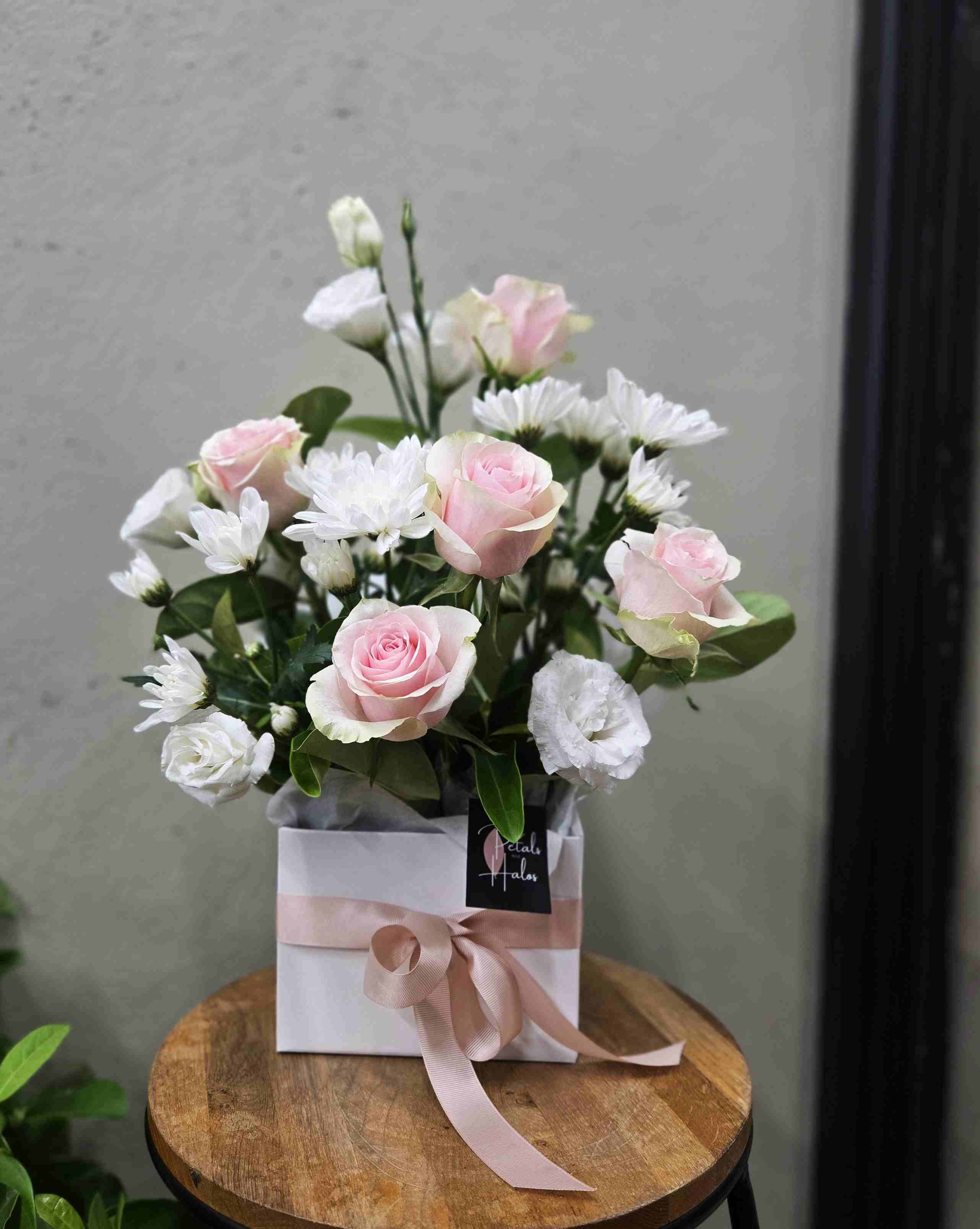 Pastel pink roses in a box sympathy flowers