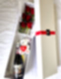 box of red roses and prosecco Valentines Day