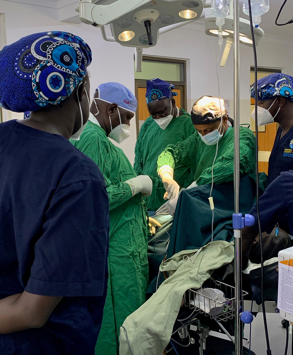 Dr. Fekade (center) demonstrates surgical methods during a complex fistula repair.