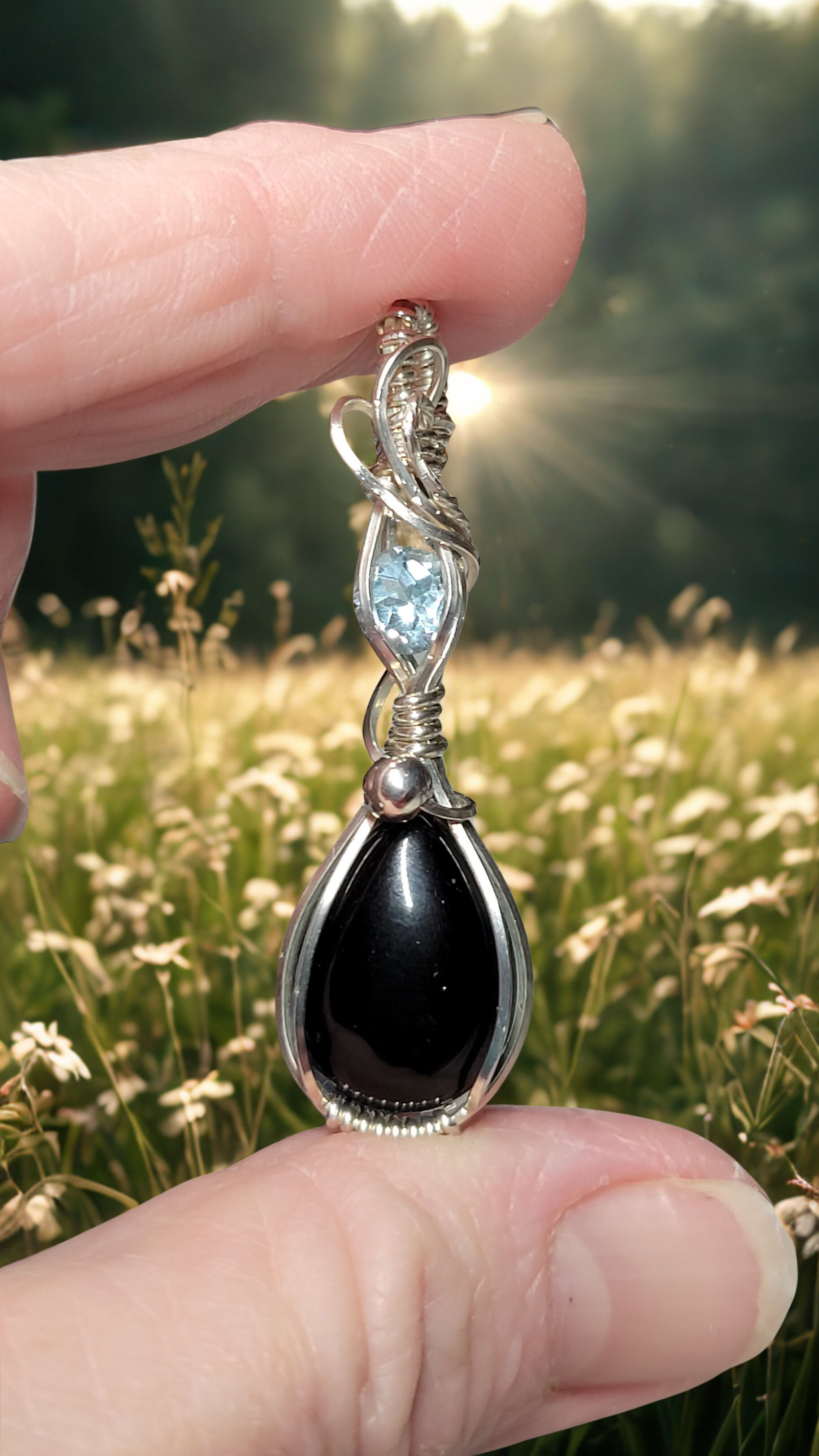 Onyx and blue topaz wrapped in sterling silver 