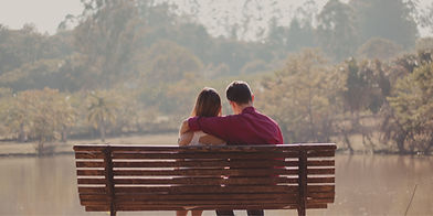 Couple sitting on a bench, representing authentic relationship work in systemic therapy and Inner Child Work.