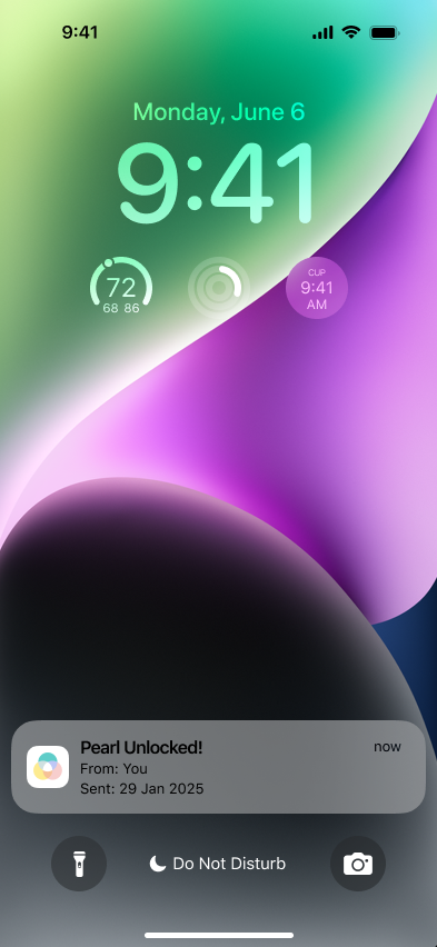 Lock screen showing a notification from the Pearls app when a Pearl is unlocked.