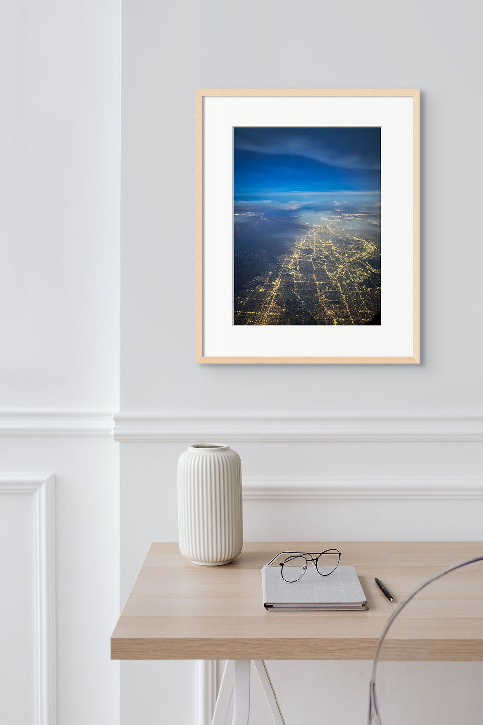 Thumbnail: A framed aerial photograph of Los Angeles at night with the Santa Ana Mountains and a deep blue sky in the distance.