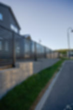 Metal Fence with Retaining Wall