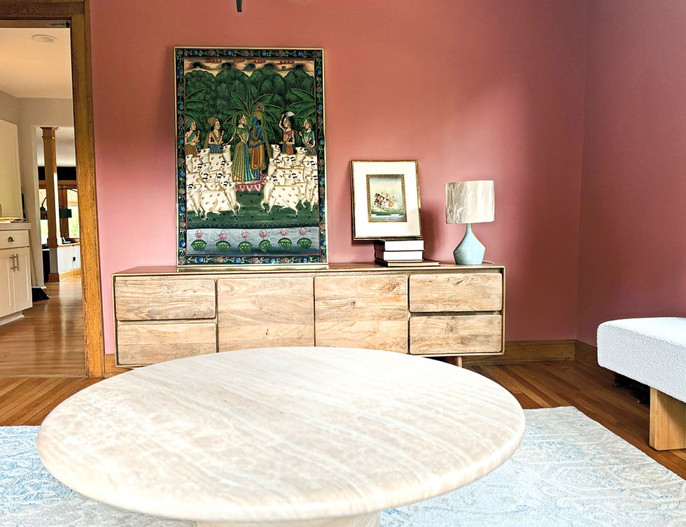 Cozy coral color drenched corner designed by interior designer Biba Studio is Williamsville, NY