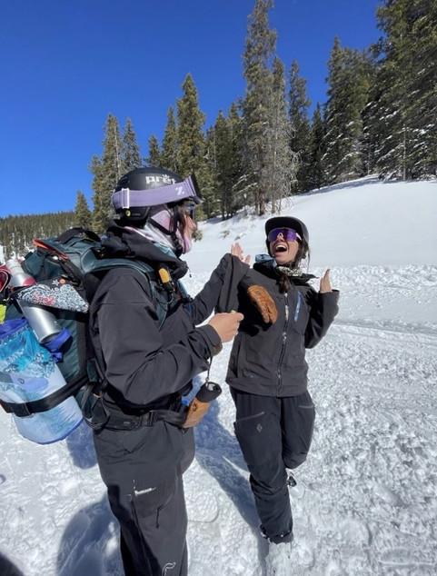 women smiling snow mountain avalanche course