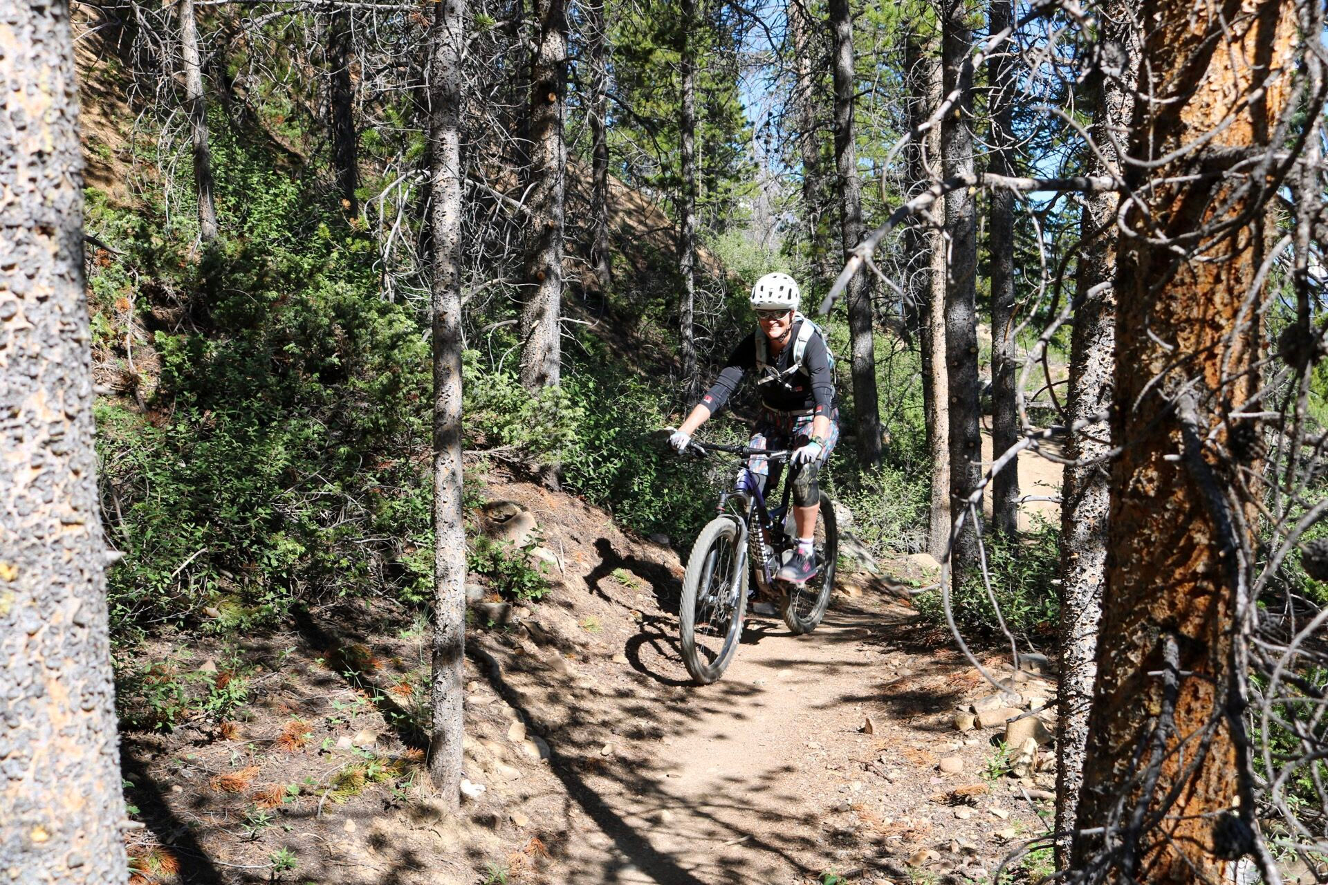 woman on bike in the forest