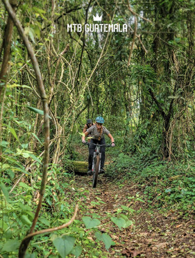 woman on bike in Guatemala forest