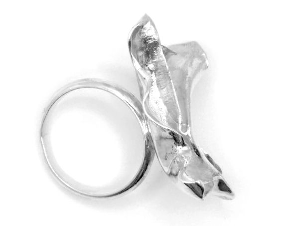 Silver statement ring in a shape of moving textile