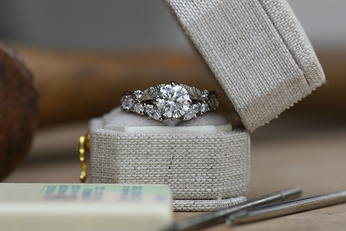 White Gold and Diamond Ring in linen box with jewellery tools_edited.png