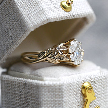a vine and floral gold and diamond engagement ring.