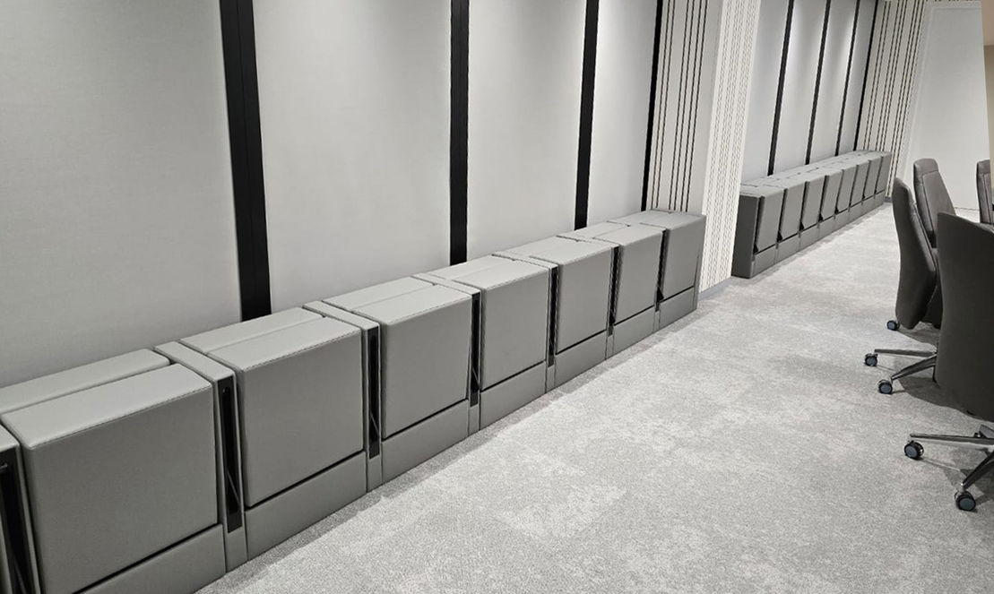 Real executive auditorium chairs with integrated writing tablets, finished with full-grain leather, manufactured by TURADI in Italy, for a confidential VIP project in Saudi Arabia.