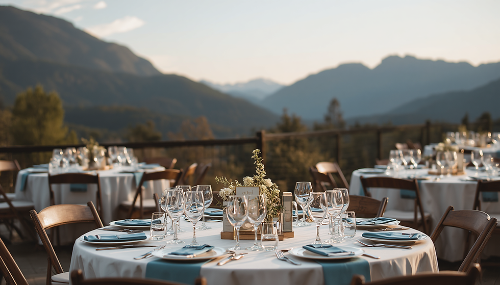 Wedding reception setting with elegantly decorated tables and mountain view in the backgro