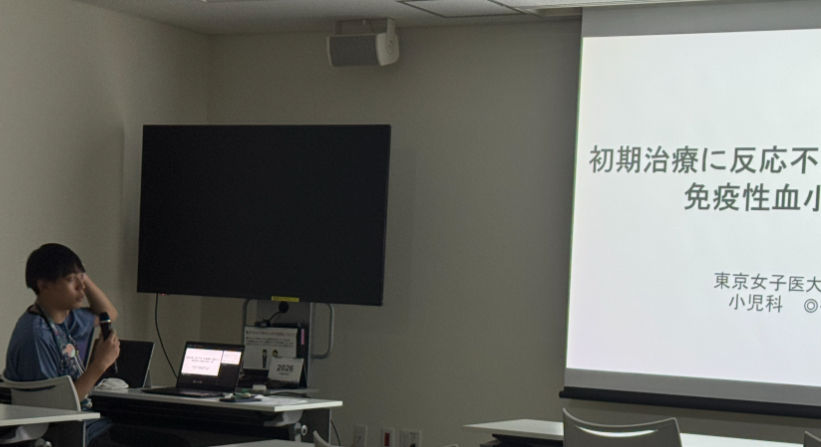 発表中の小菅先生