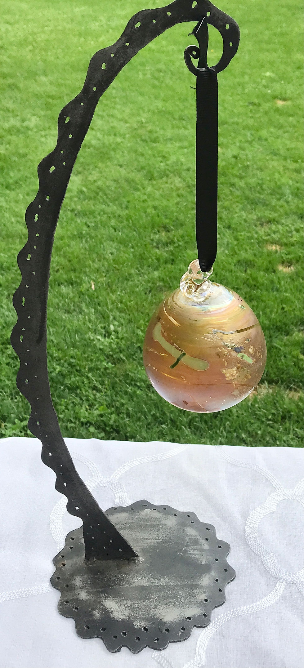 Thumbnail: Handcrafted Swirling Golden-Peach Luster Glass Friendship or Witch ball Ornament