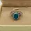 Thumbnail: Vintage Oval Shape Blue Opal Set in a Gothic Design Ring Size 7 1/2