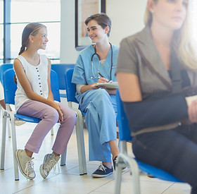 Nurse And Patient In Waiting Room