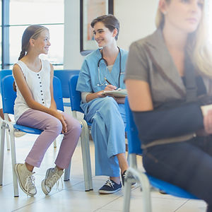 Nurse And Patient In Waiting Room