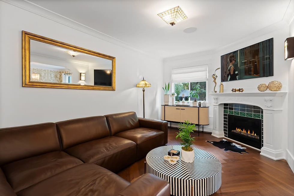 A living room with a green fireplace