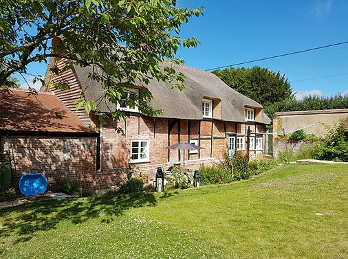 Window frames repainted in stunning thatched property