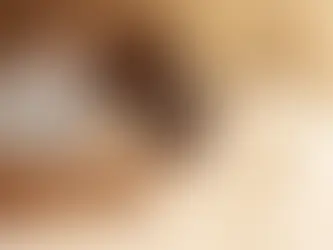 two women talking together on bed