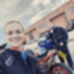 Charis in front of motorcycles